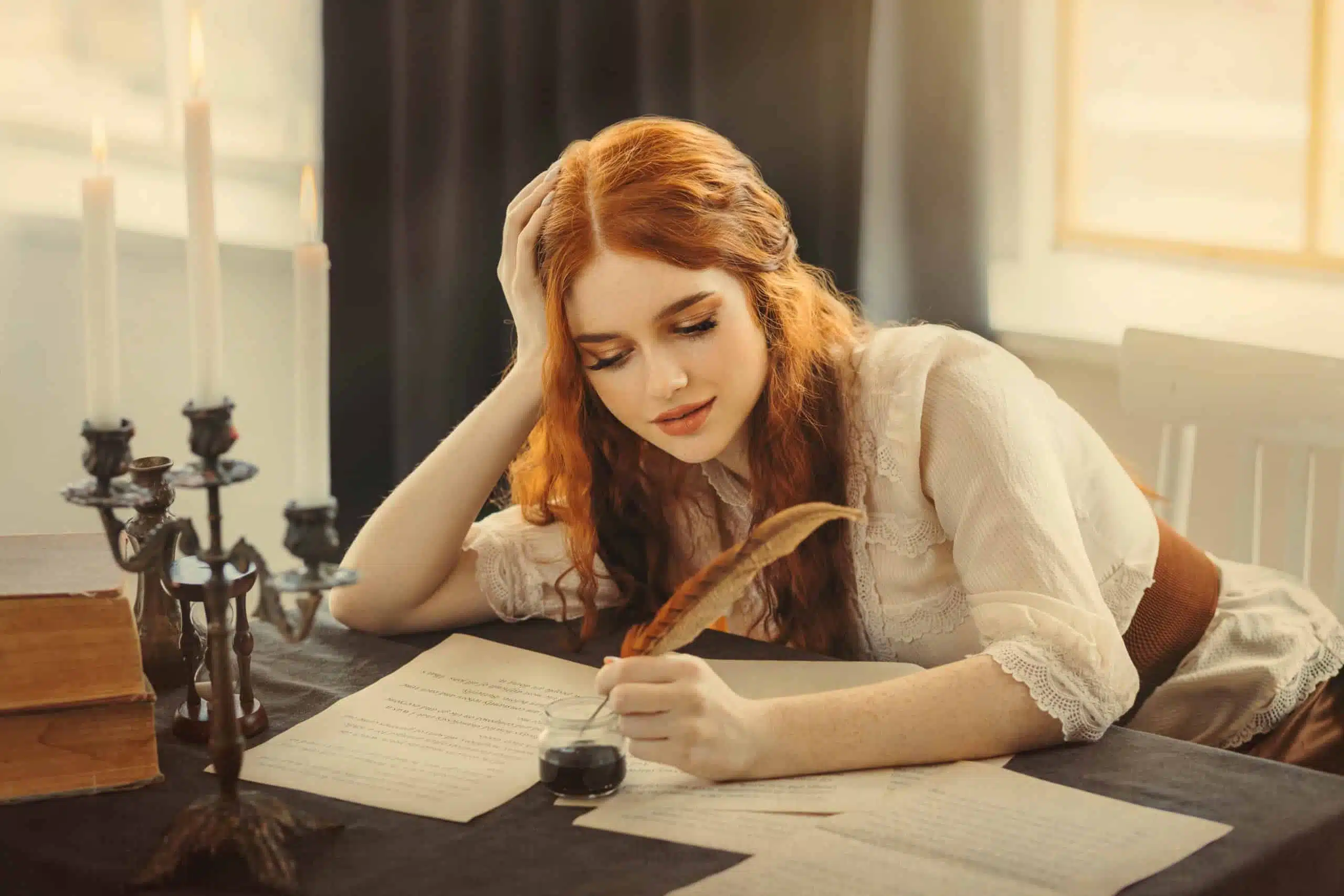 Medieval red-haired female writer holds pen feather quill in hands, sits at table writes letter on sheet paper.