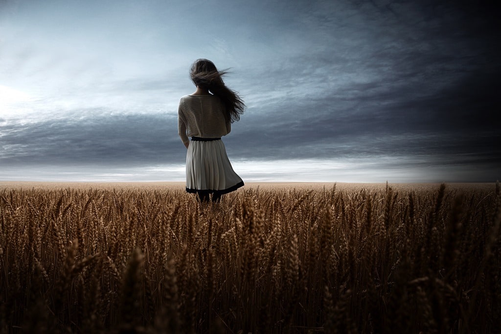 Lonesome girl in wheat field.