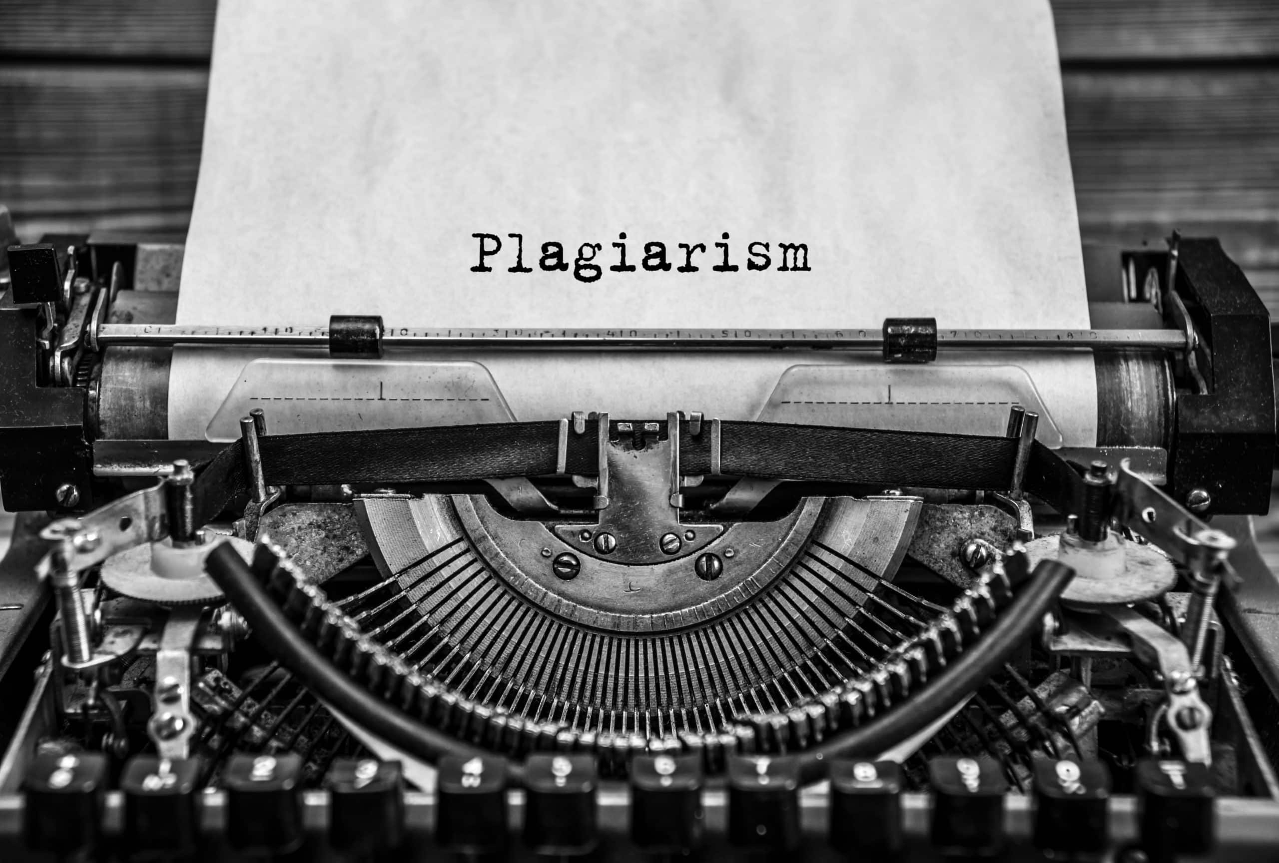 Word plagiarism printed on a vintage typewriter.