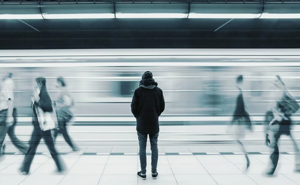 Long exposure picture with lonely man at subway station