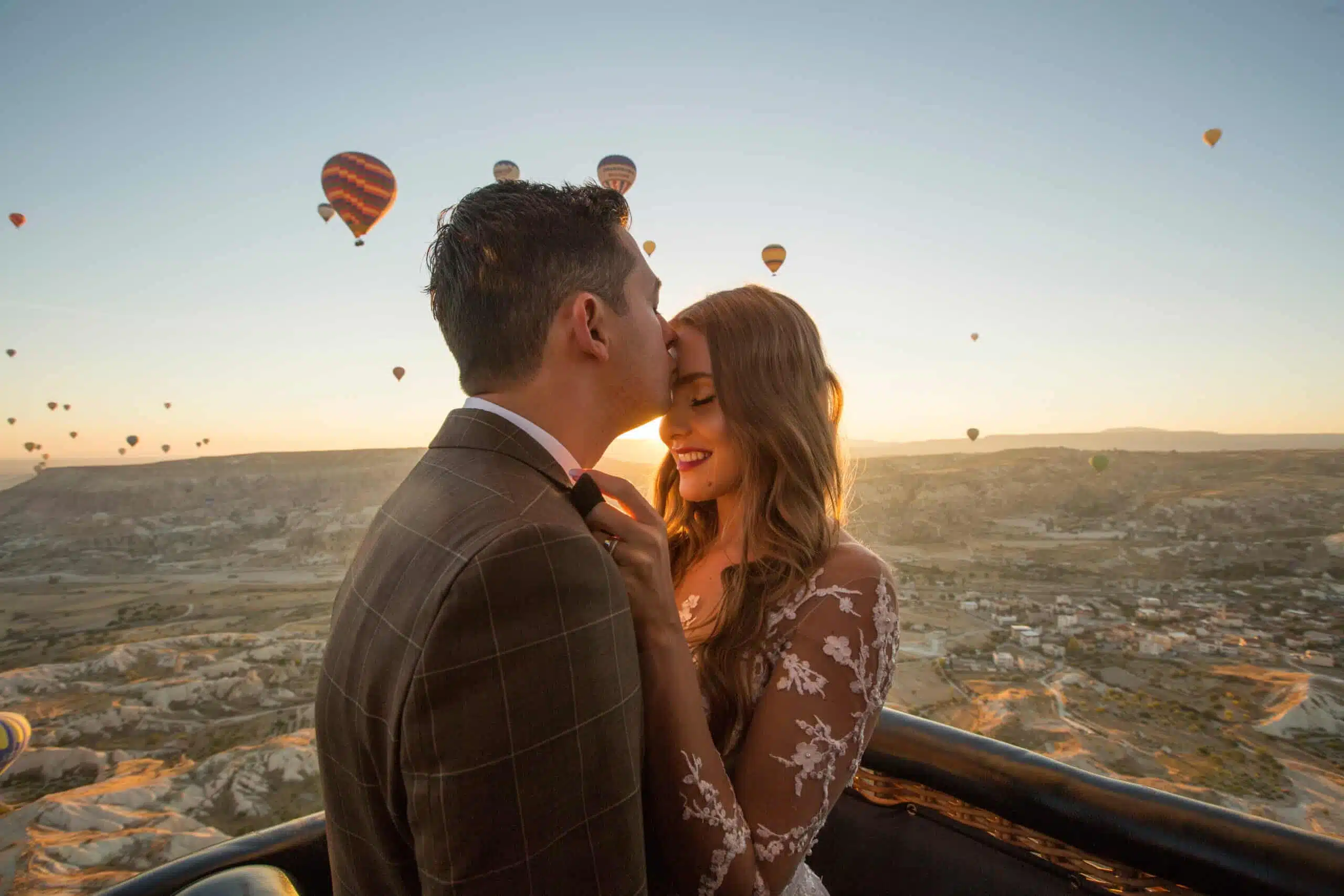 Beautiful wedding couple posing in balloon near Cappadocia
