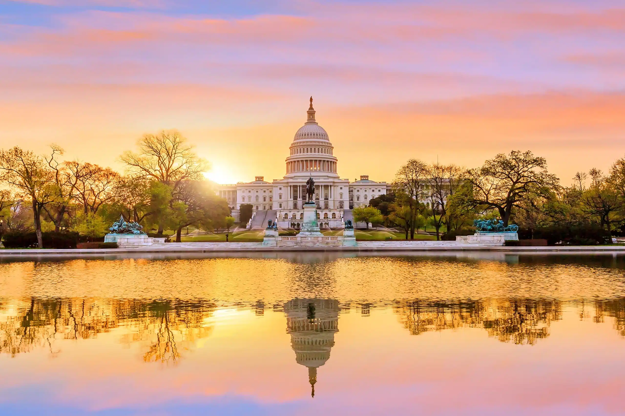 Capitol building in Washington DC at beautiful purple sunset.