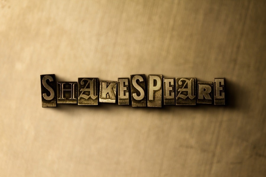 Grungy vintage typeset word Shakespeare on metal backdrop.