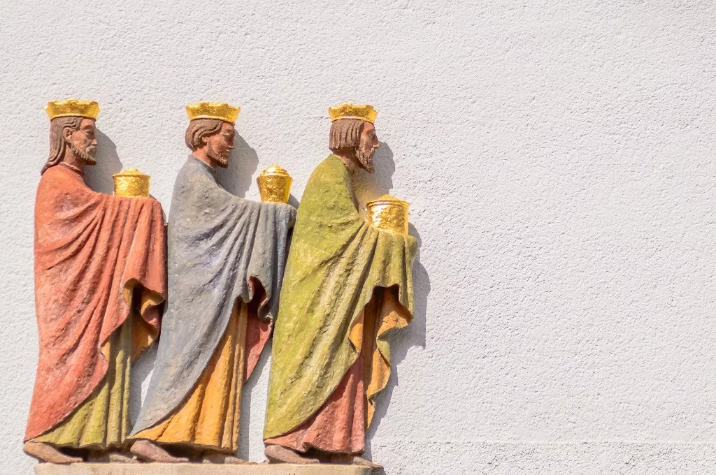 Three wise men relief on a wall.