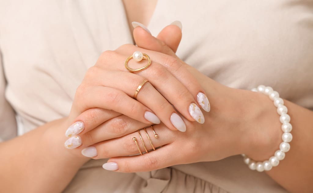 Young woman with beautiful manicure and accessories