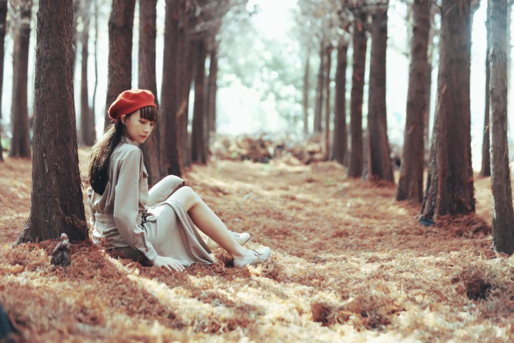pretty asian girl relaxing nature in autumn