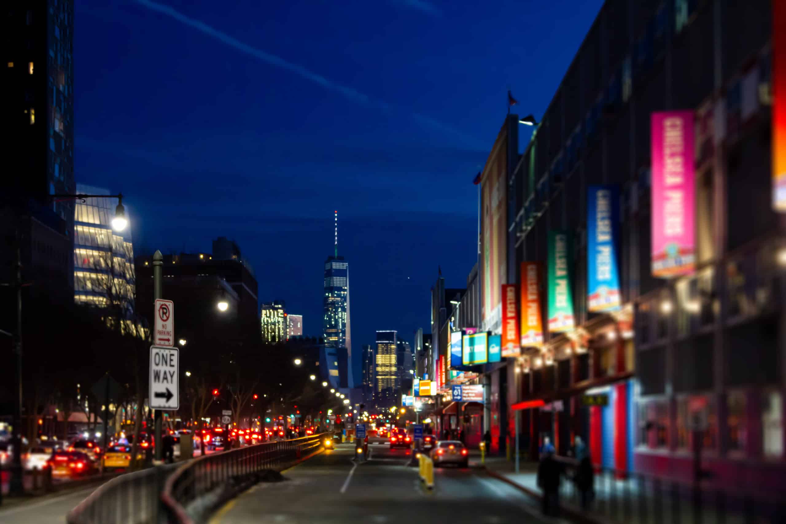 New York City night street scene at Chelsea Pier with blurred lights.