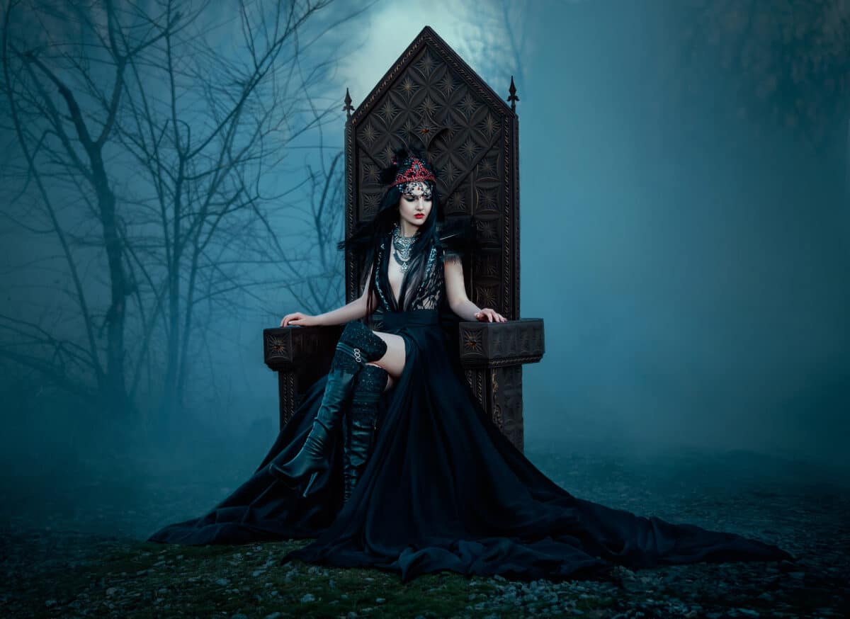 dark evil queen sitting on a luxurious throne,dark boho, cosplay to the film SNOW WHITE AND THE HUNTSMAN ,wild Princess , vampire , hip toning , creative color. dark boho