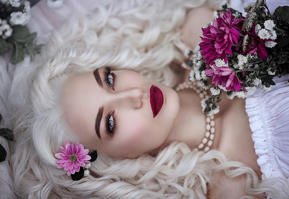 beautiful white haired young woman with fierce blue eyes