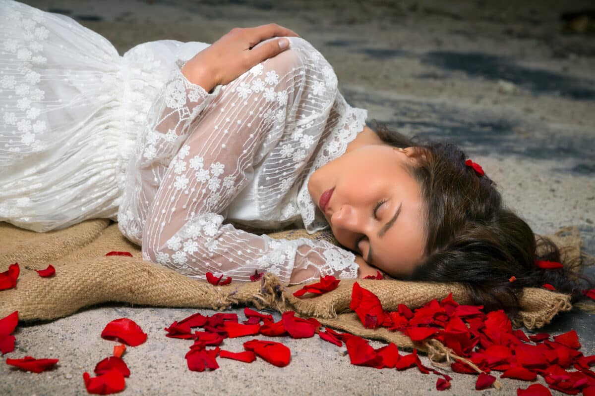 Beauty and rose petals on the ground