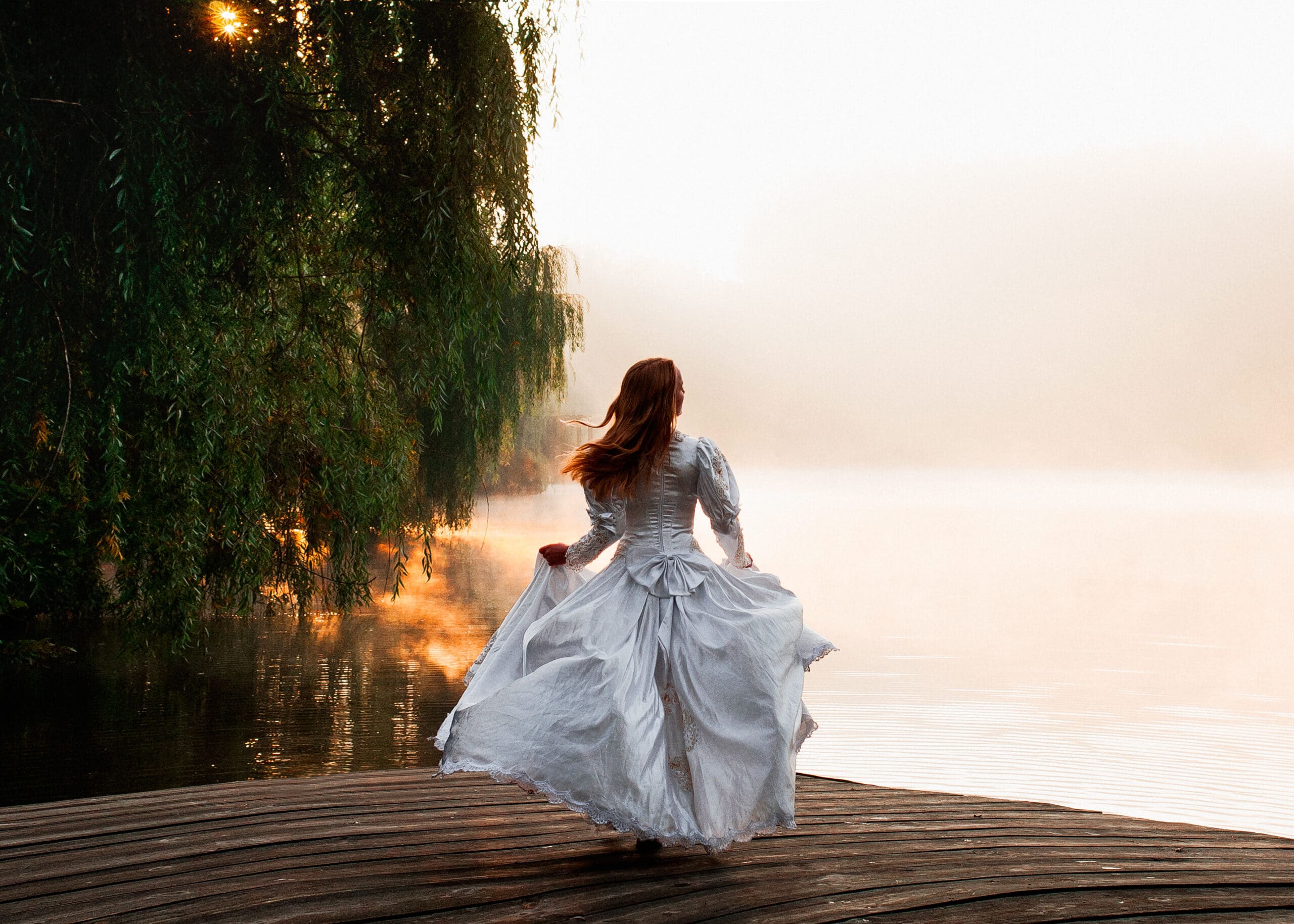 Girl in white dress on lake