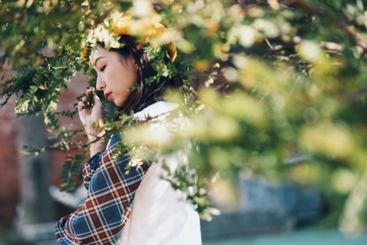 young asian vintage girl enjoying the spring flowers