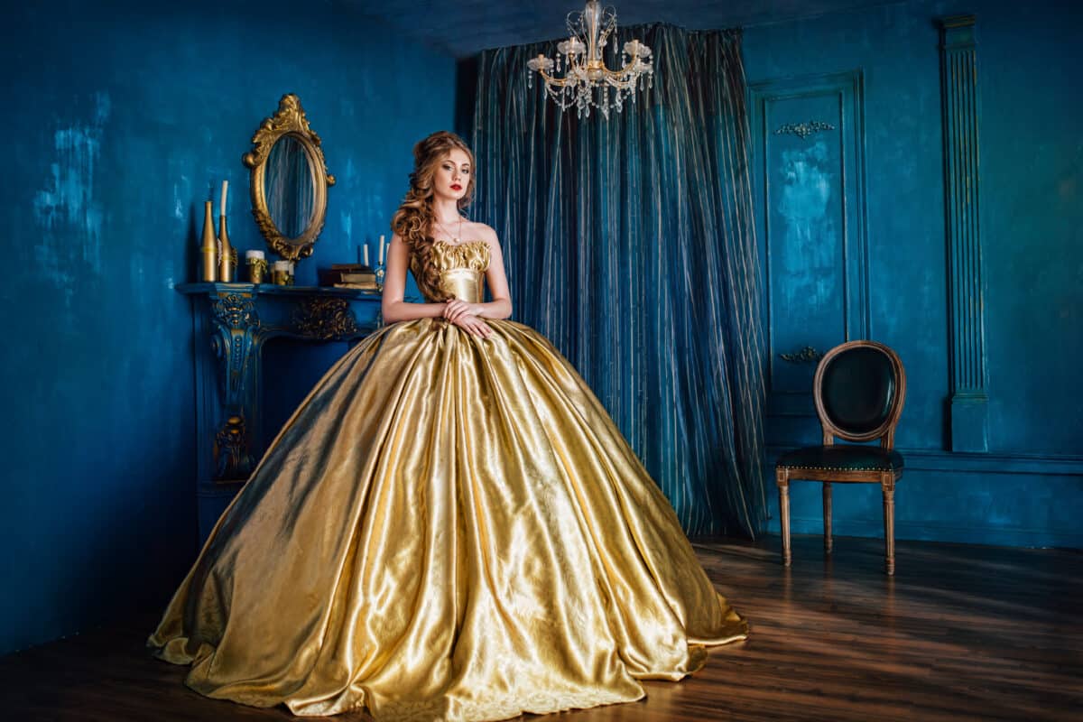 Beautiful woman in a gold ball gown