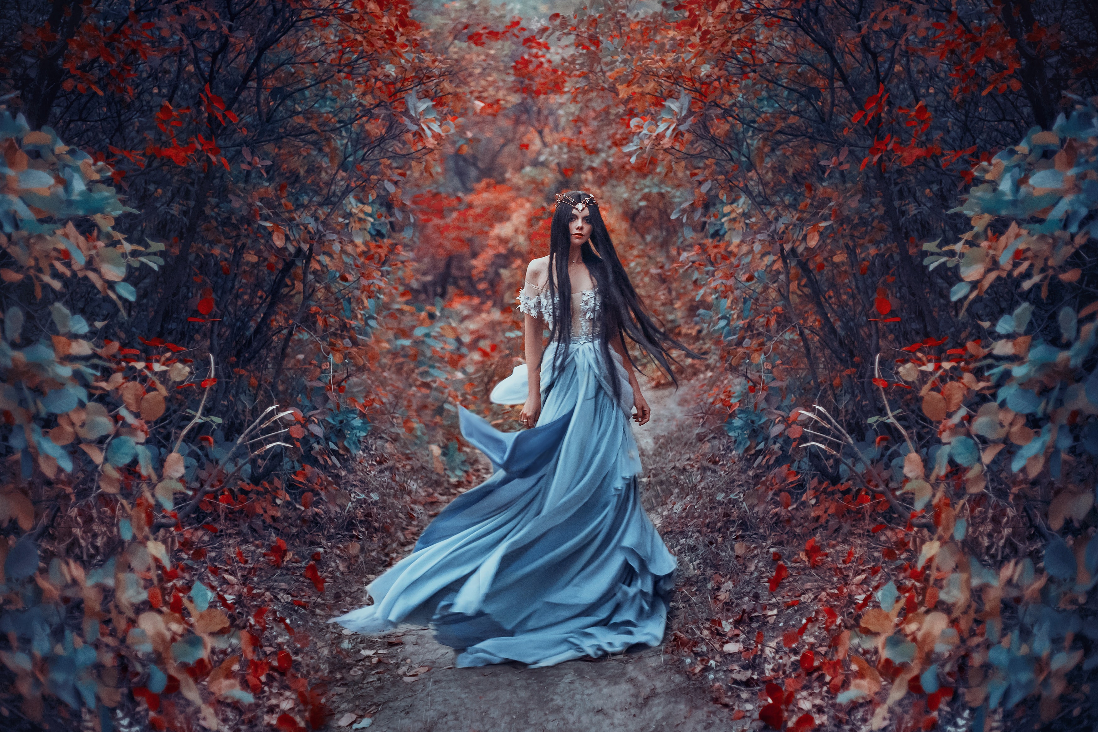 Mysterious fantasy woman elf sorceress in blue dress. 