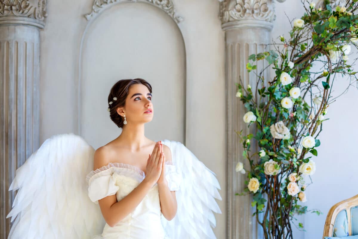 beautiful woman with angel wings inspires beauty