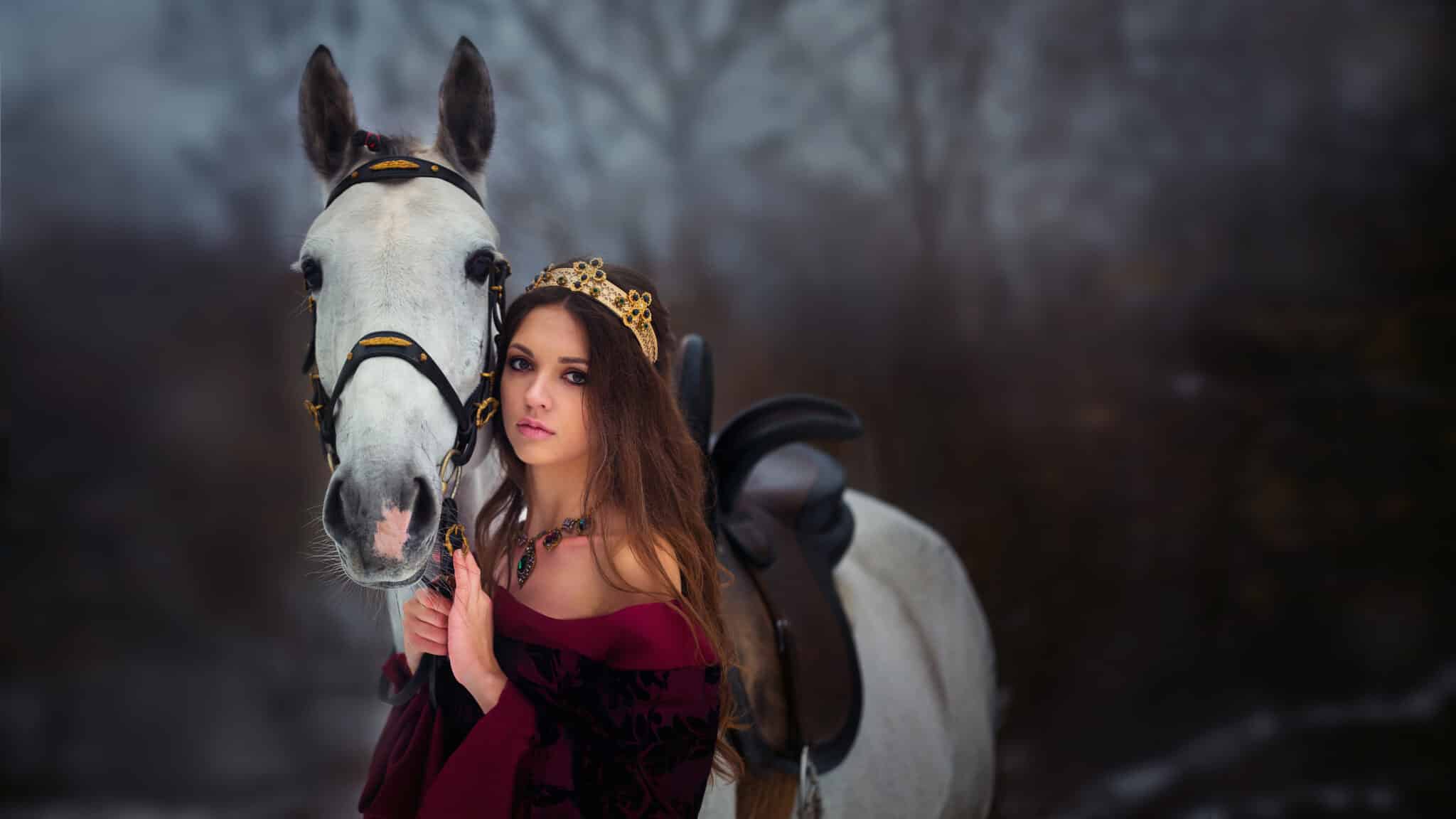 a medieval princess with a white horse