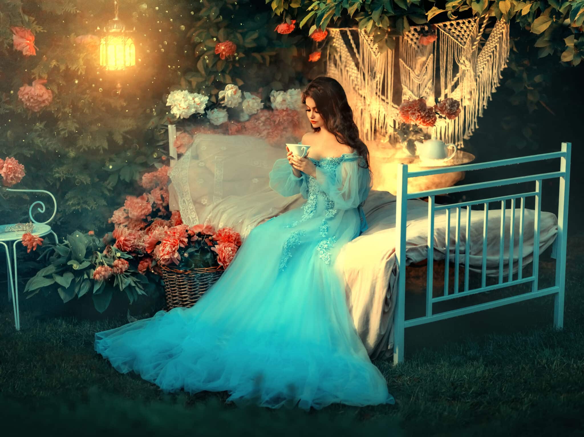 Fairy tale princess sits on white bed.