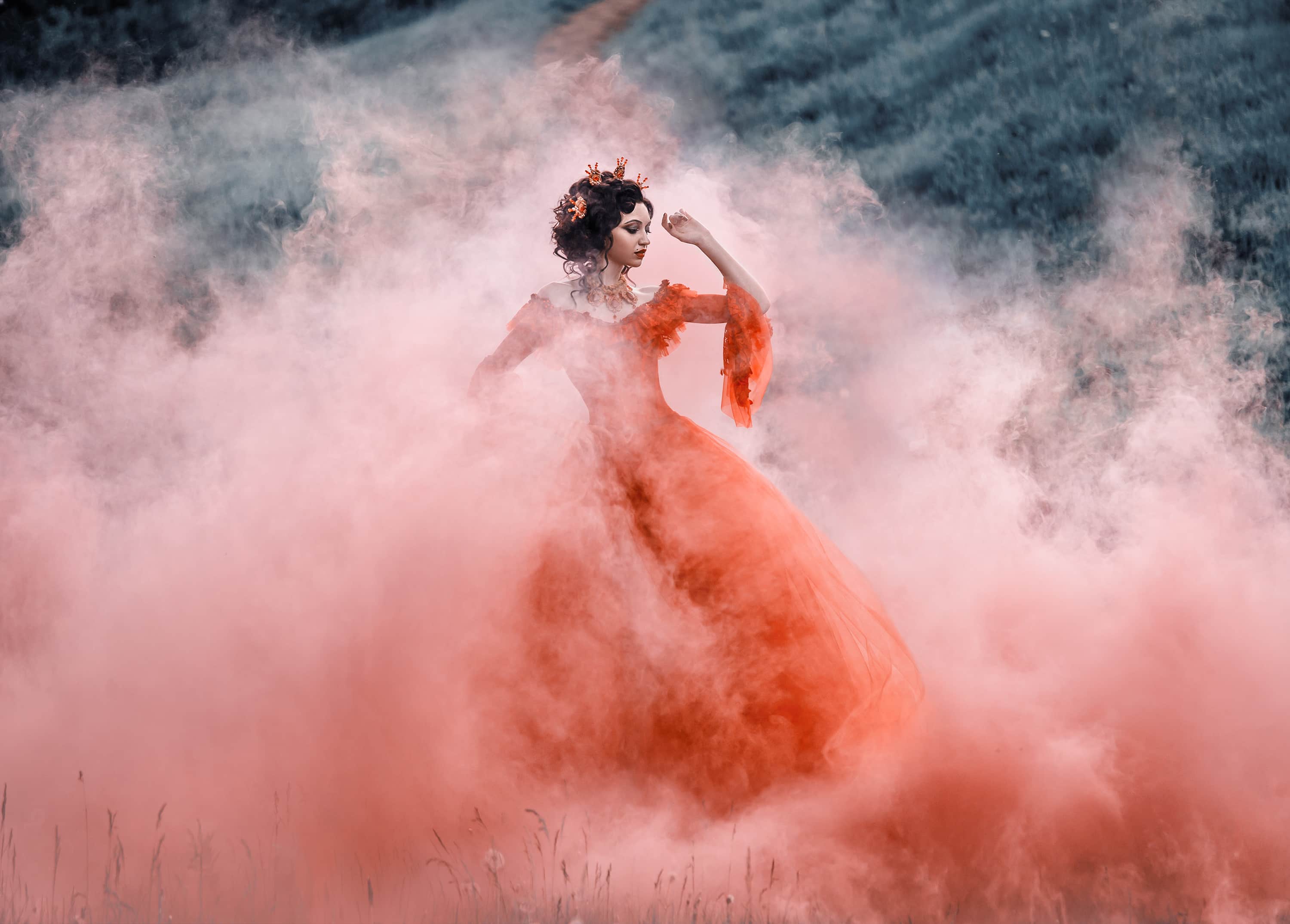 Lady in a luxury lush red dress swirls in the smoke,fantastic sh