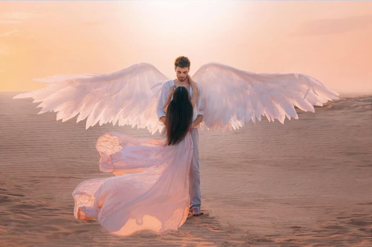 Men angel hugs young woman 