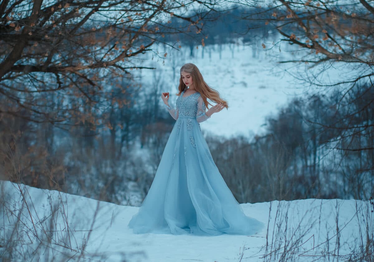 Lady in a luxury lush blue dress, fantastic shot, fairytale prin