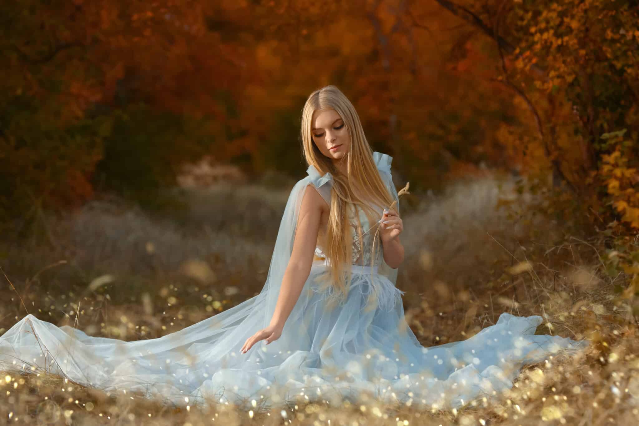 Beautiful fairy in autumn forest