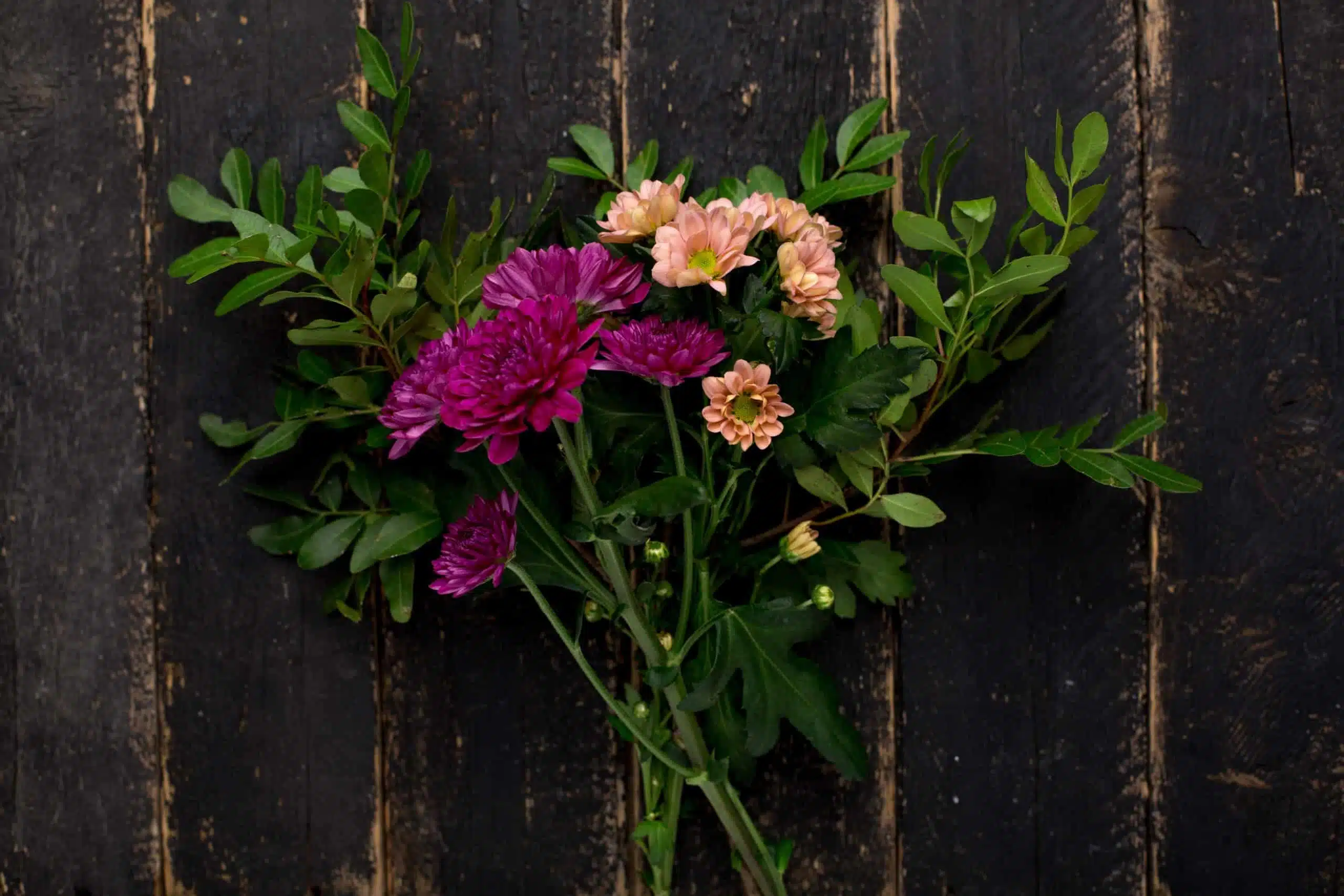 A bouquet on a wooden rustic background.