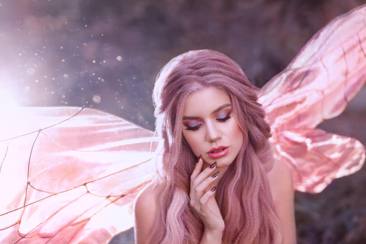 cute faun girl with rose hair with glowing bright pink butterfly wings sit alone in the forest in the morning sun, portrait of a young lady, gorgeous fabulous fantasy photo with highlights