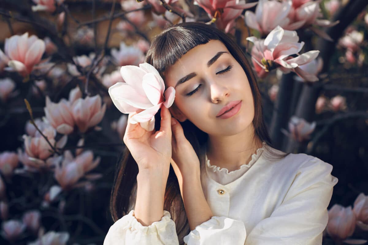 Beautiful bride and magnolia flowers