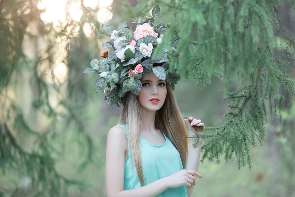 The girl with the wreath on his head in the woods