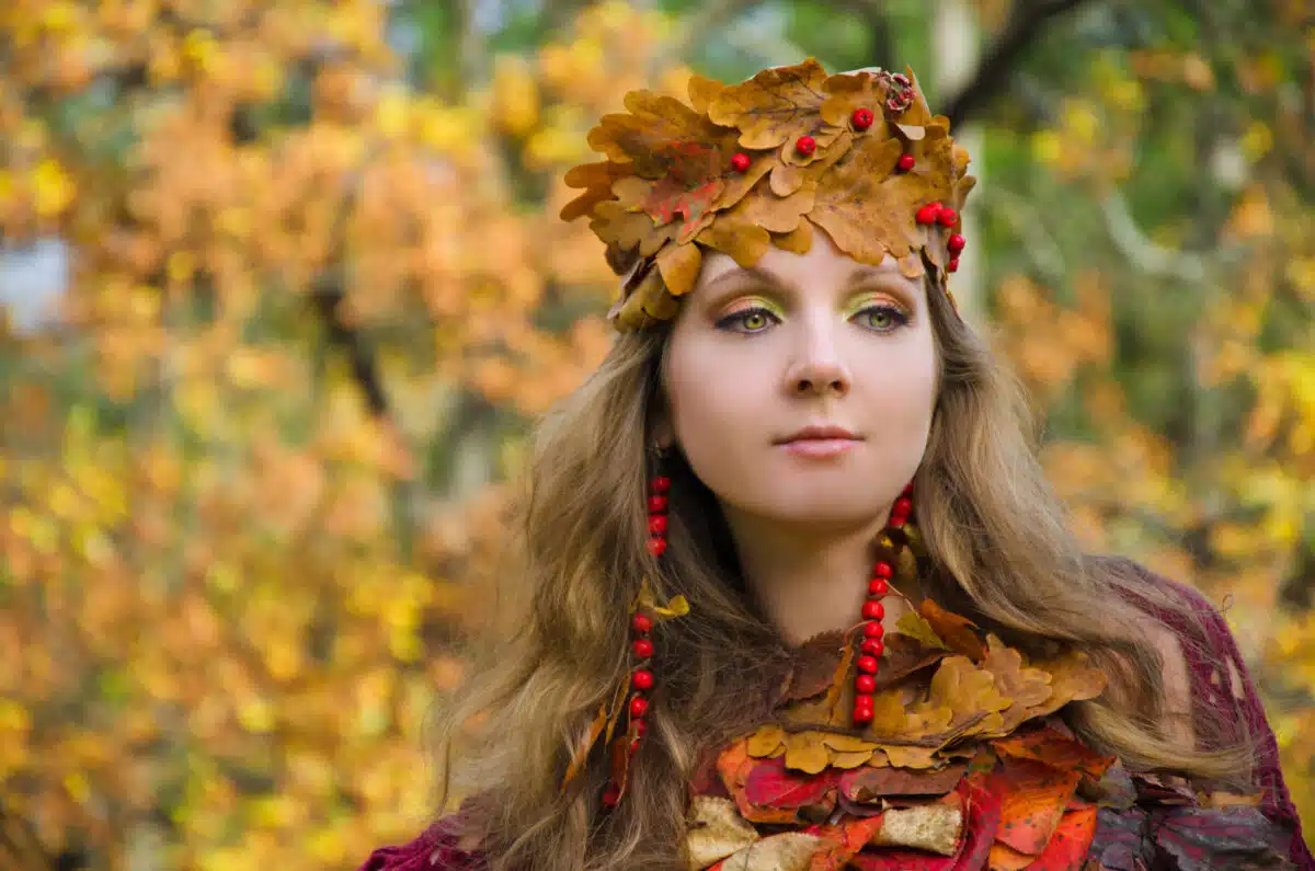 an autumn forest fairy in a crown of leaves