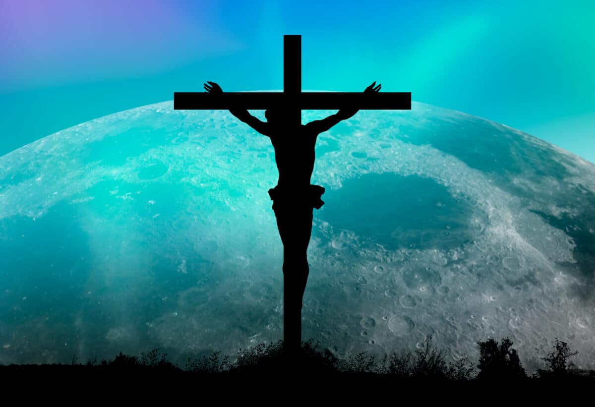 Jesus on the cross against super moon