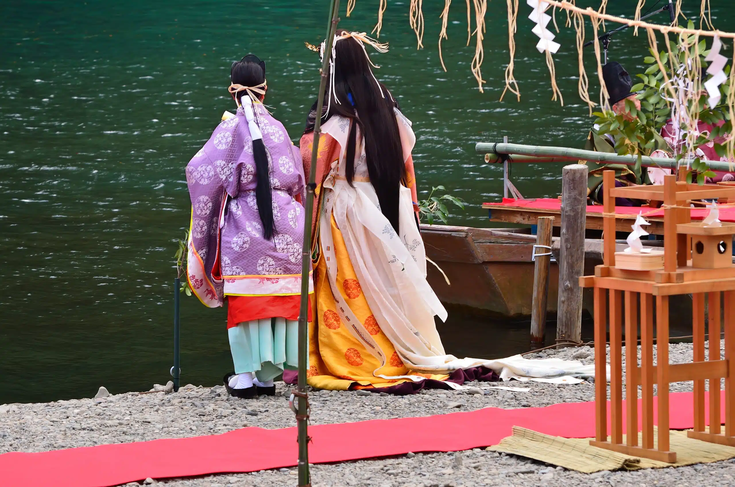 Traditional Japanese princes having a conversation by the river.