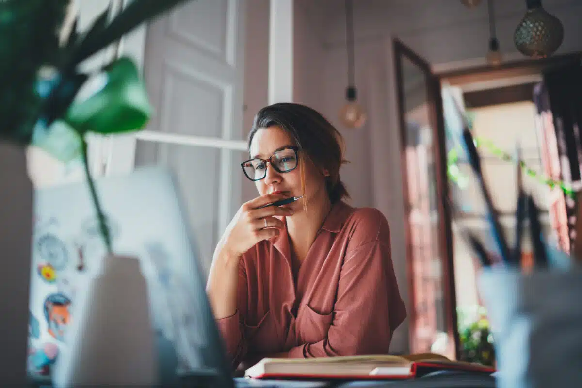 Young businesswoman thinking about something while sitting front.