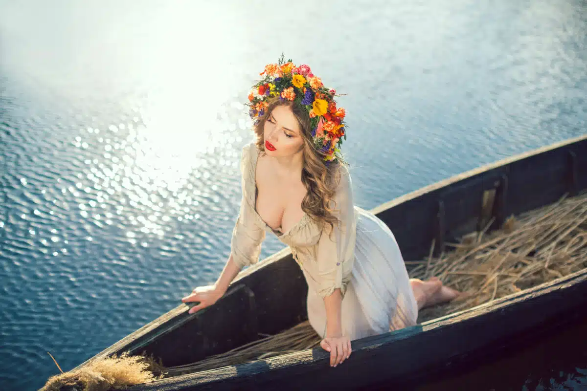 Beautiful girl sitting in the boat