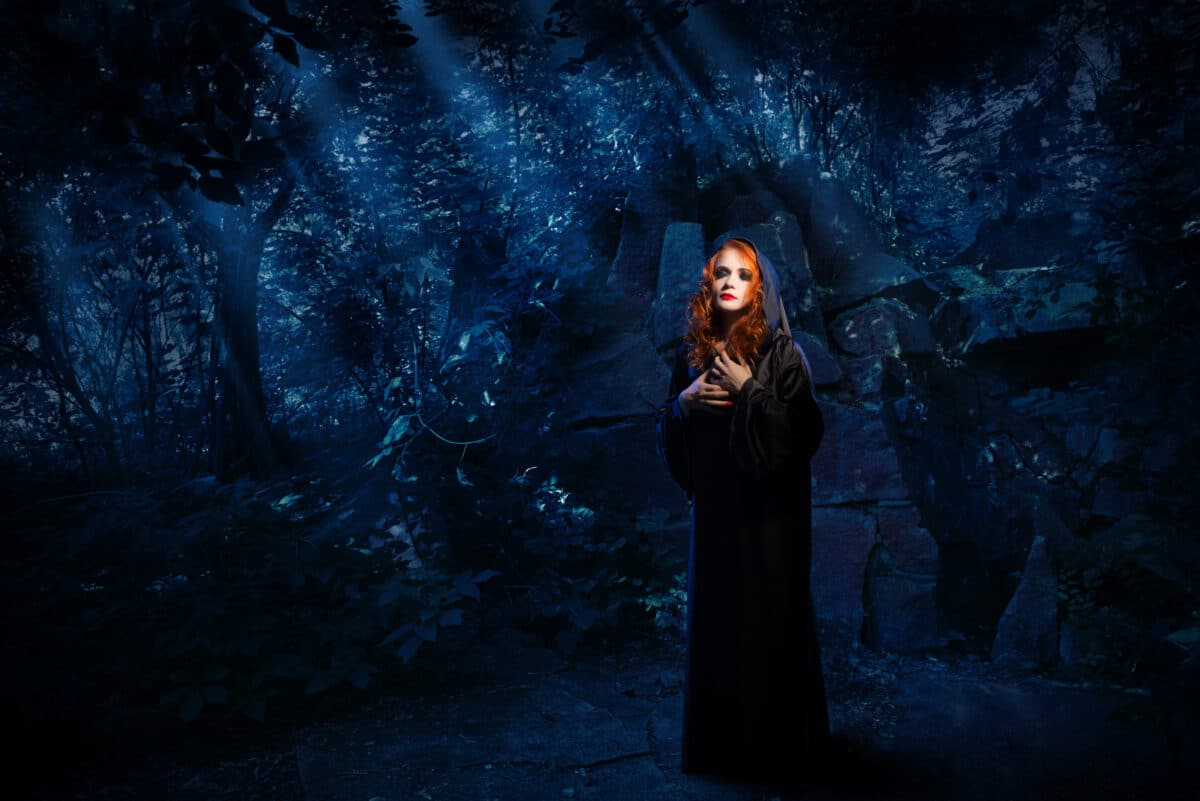 Witch in night forest