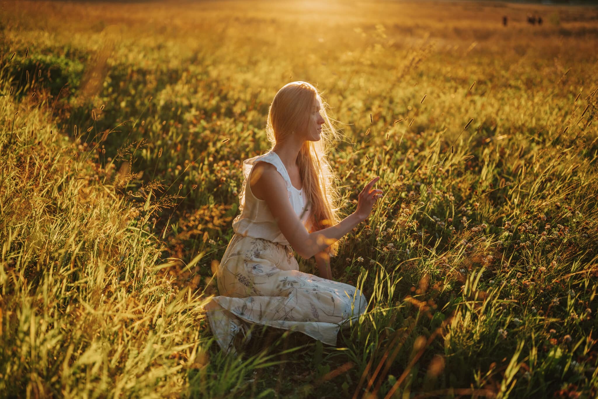 woman in the field at sunrise