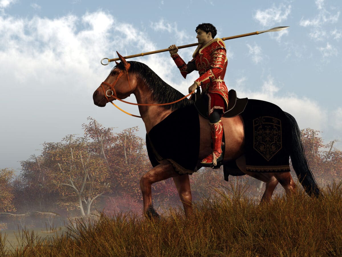 A knight in red armor rides on horseback through an autumn lands