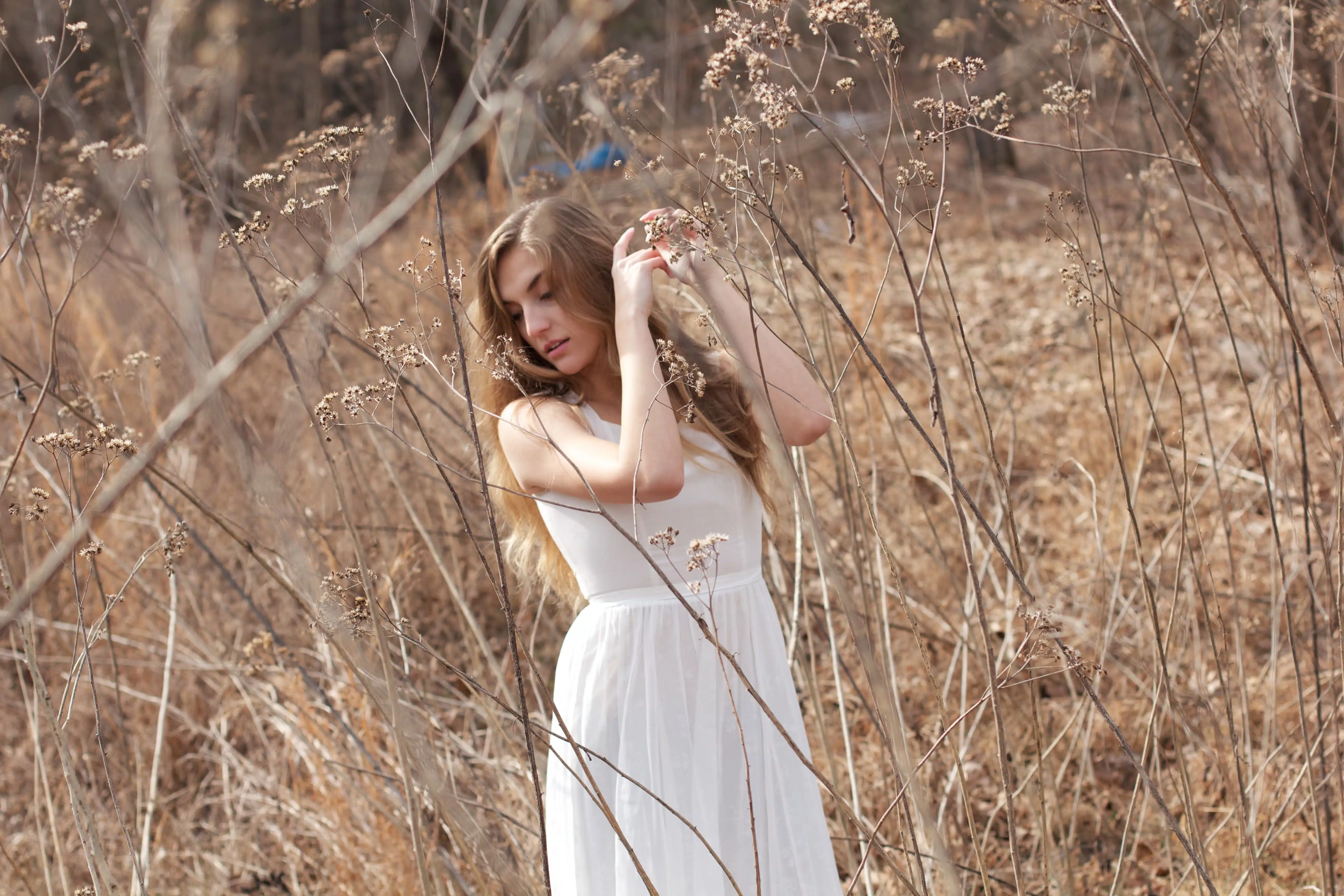 Woman in white dress in a field