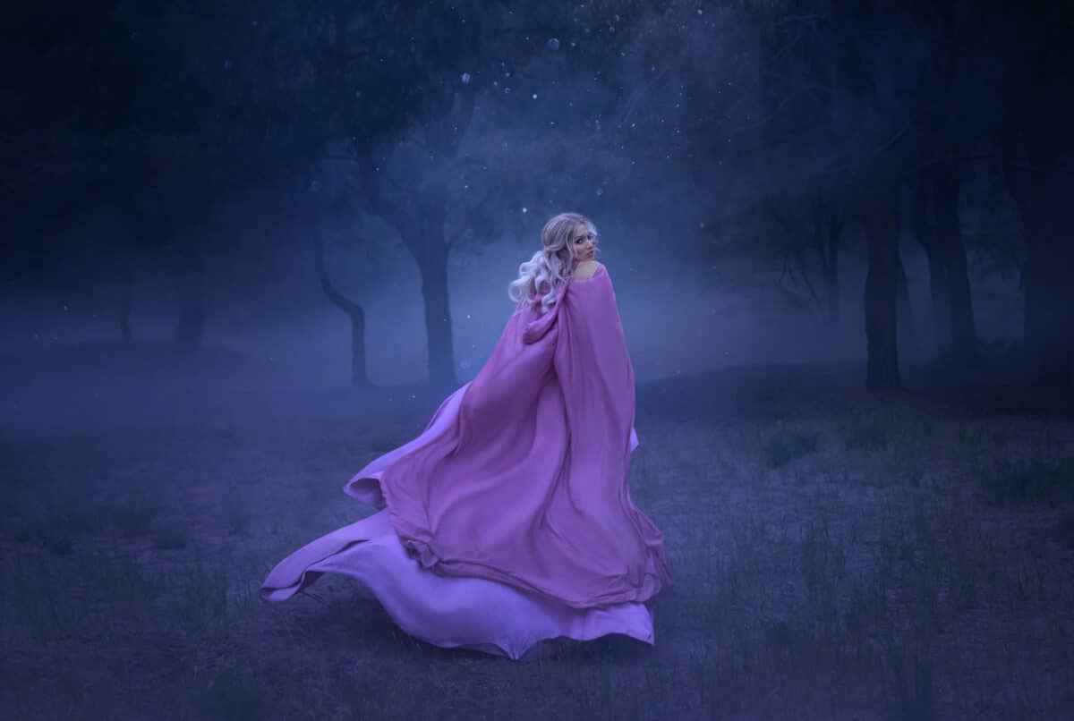 a gorgeous young elf princess with blond hair that flees in a forest full of white mist, dressed in a long, expensive, flying and fluttering purple dress, a photo of a beautiful woman in the moonlight