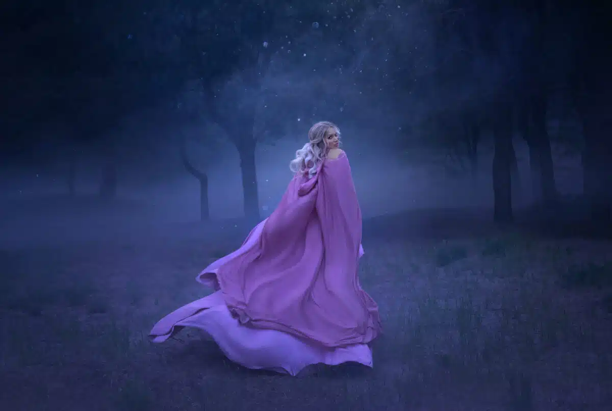 a gorgeous young elf princess with blond hair that flees in a forest full of white mist, dressed in a long, expensive, flying and fluttering purple dress, a photo of a beautiful woman in the moonlight