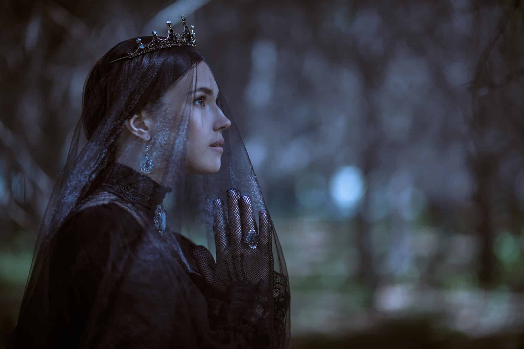 sorrowful princess in black dress with veil