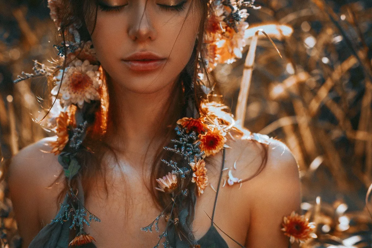 Lovely woman with flowers on her hair.