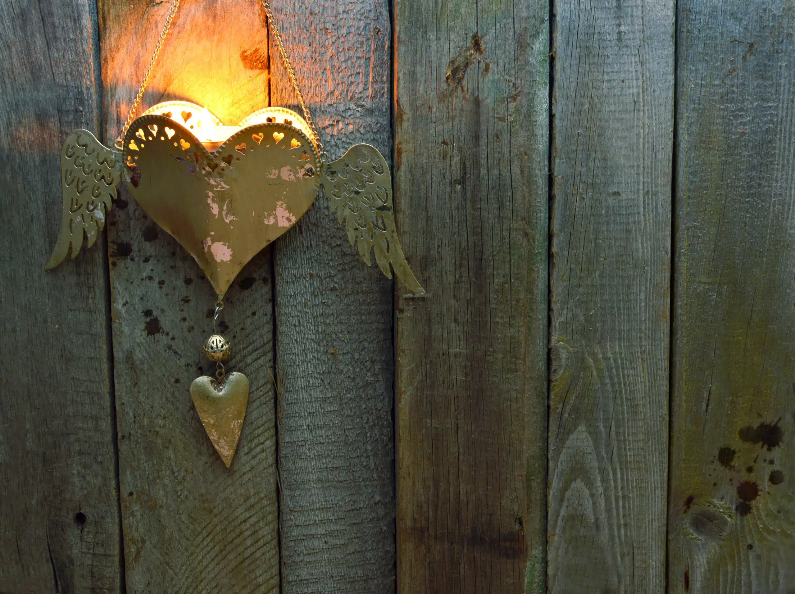 rustic heart with wings wall candle holder.