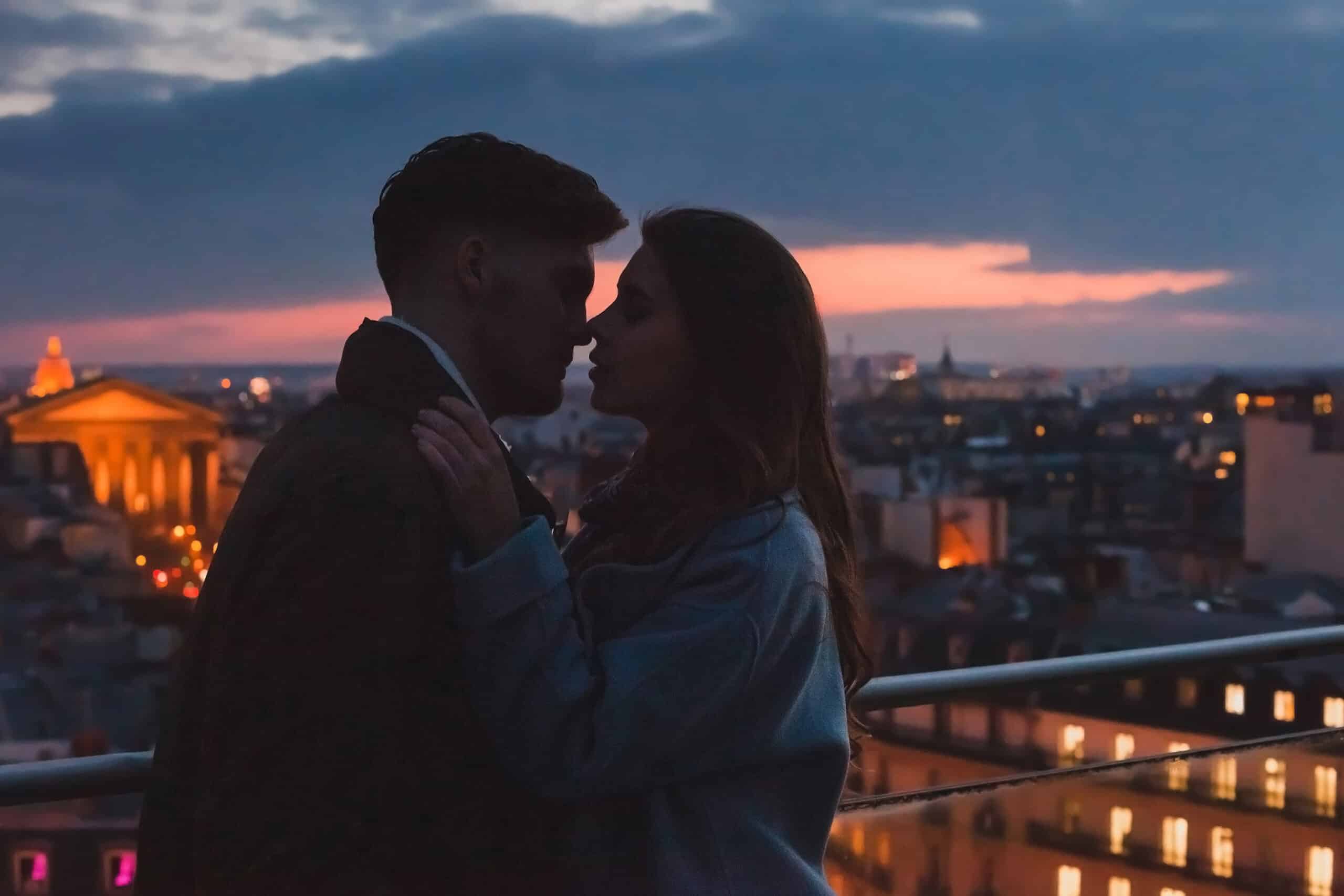 love, couple kissing on night city skyline view, romantic honeym