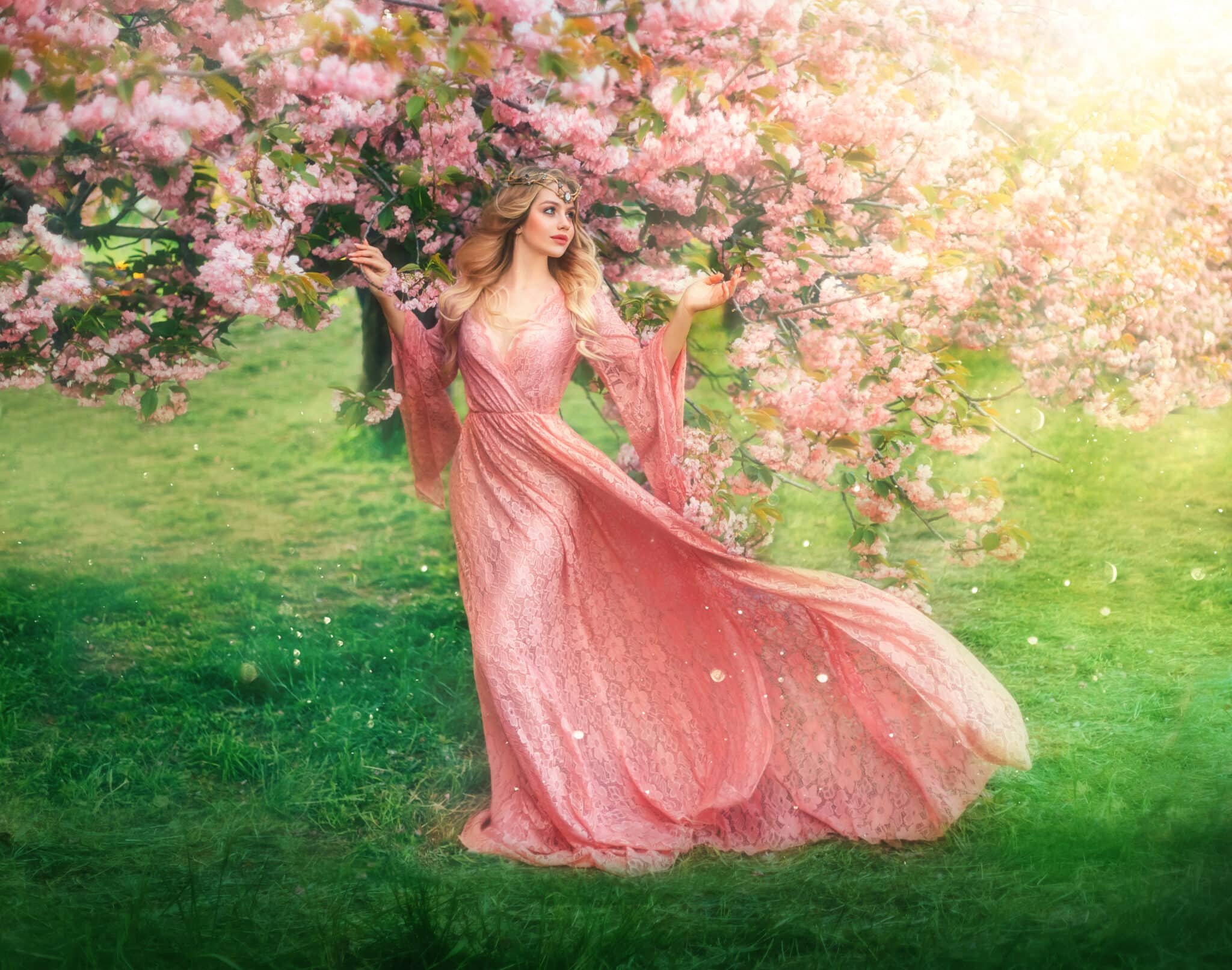 hapy girl elf princess walks in spring blooming garden