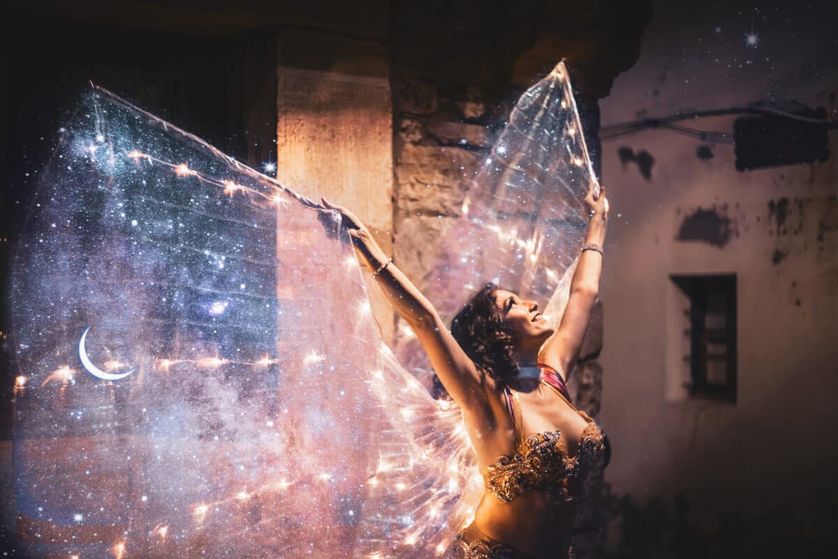 Belly dancer with starry wings and gold dress