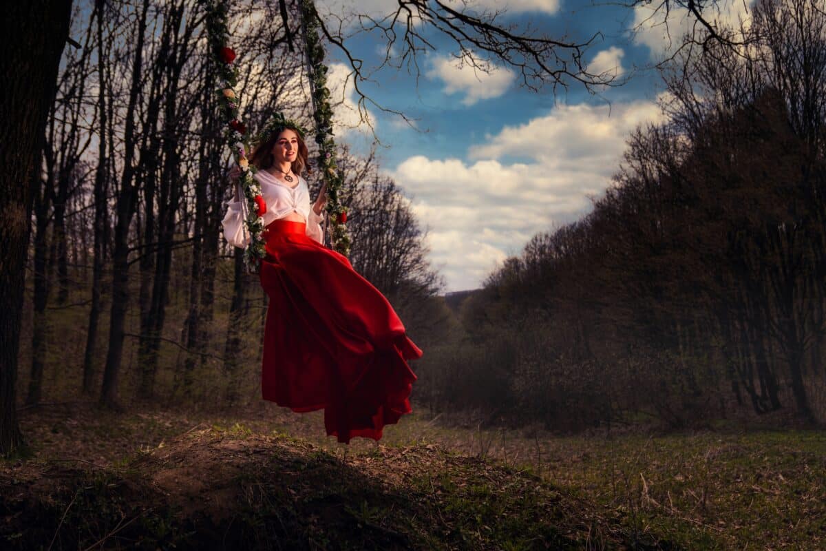 Caucasian female in a beautiful dress in the forest