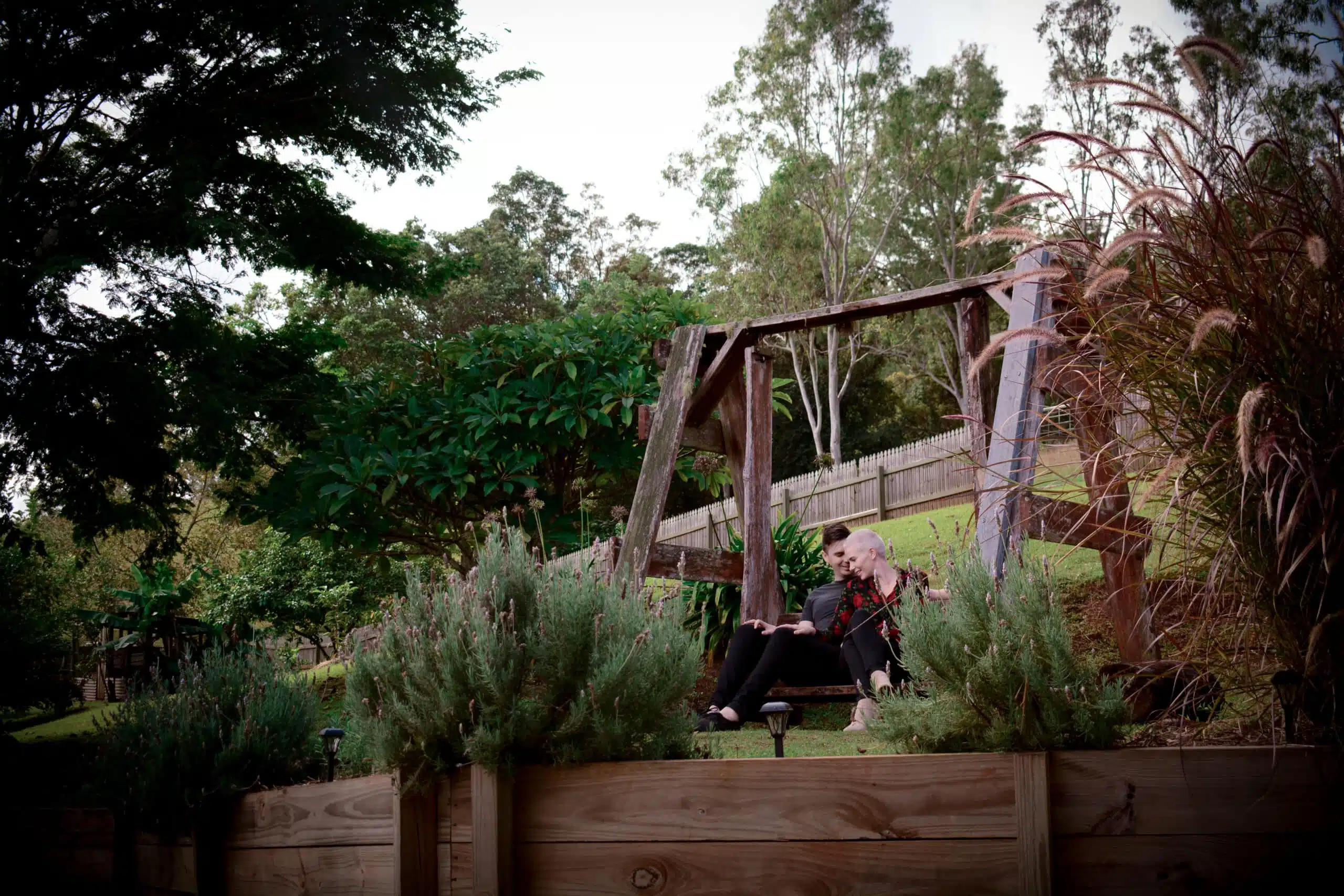 Couple Sitting on Swing Cuddling