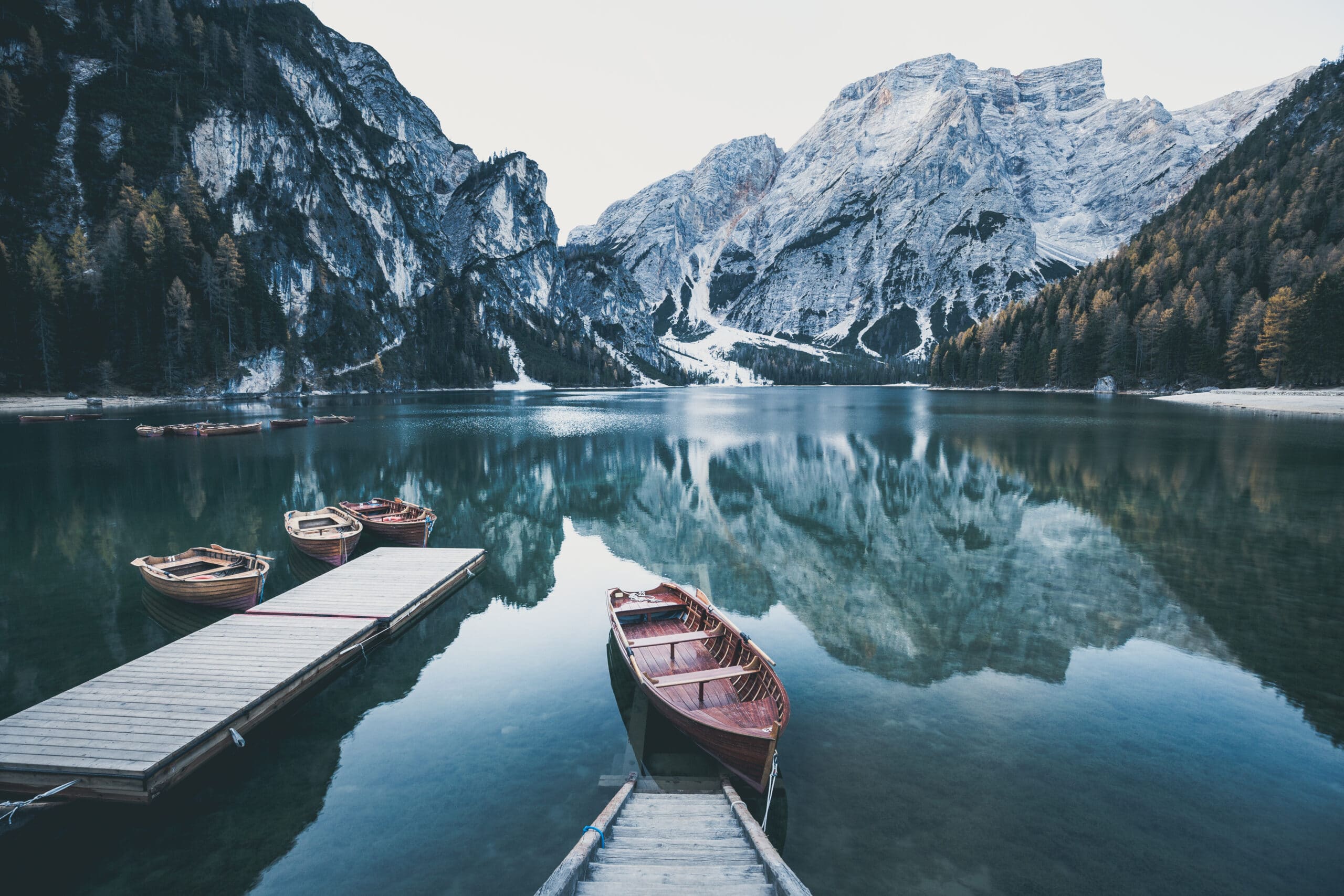 Wooden boat at the alpine mountain lake