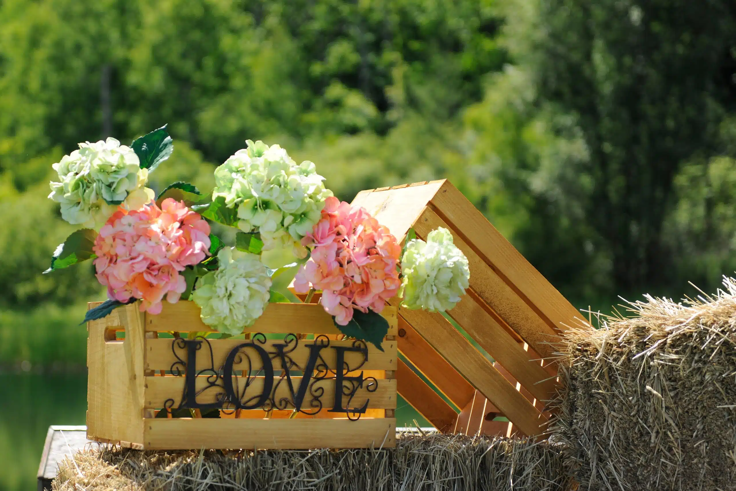 Flowers in rustic box with inscription LOVE